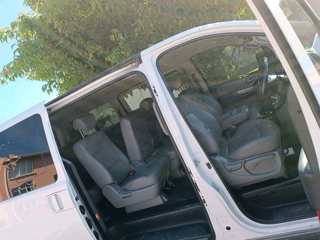 Passenger van interior with comfortable grey leather seating