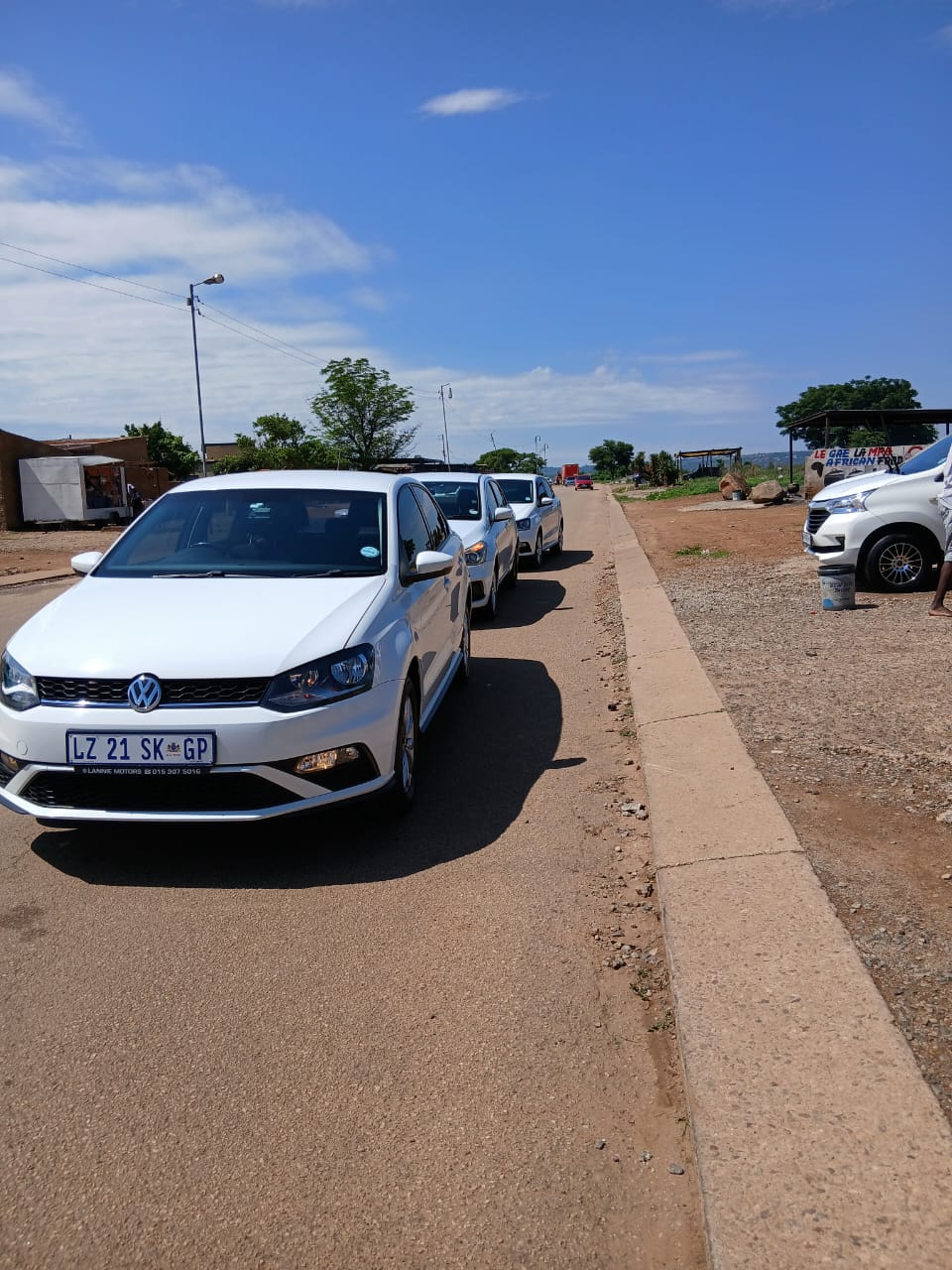 White RR Elite sedans lined up for service