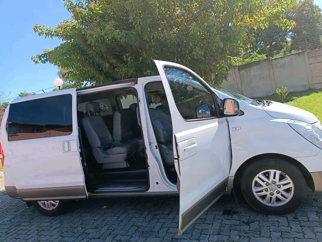 White passenger van with its doors open for easy access